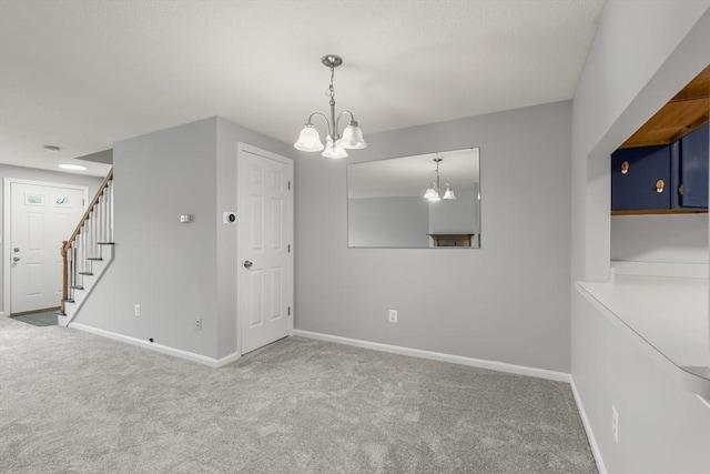 728 Auburn St Unit E4, Whitman, MA 02382 - unfurnished room with a chandelier, carpet flooring, and stairs