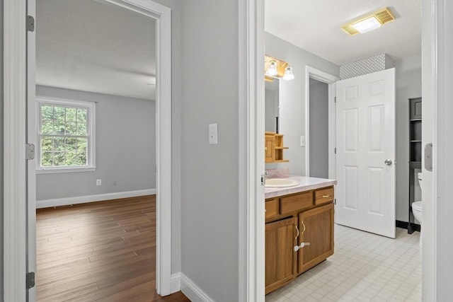 728 Auburn St Unit E4, Whitman, MA 02382 - bathroom with vanity and wood finished floors