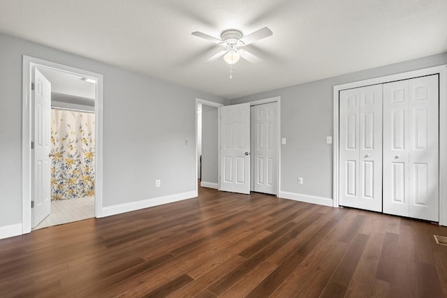 728 Auburn St Unit E4, Whitman, MA 02382 - unfurnished bedroom with multiple closets, dark wood-style flooring, ensuite bath, and ceiling fan