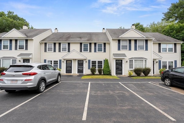 728 Auburn St Unit E4, Whitman, MA 02382 - townhome / multi-family property featuring uncovered parking and a chimney
