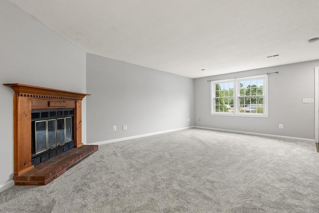 728 Auburn St Unit E4, Whitman, MA 02382 - unfurnished living room featuring a fireplace and carpet flooring