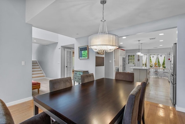 4 Benjamin Pl Unit 4, Brookline, MA 02467 - dining room featuring stairs, french doors, light wood-type flooring, a chandelier, and recessed lighting