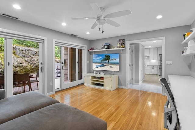 4 Benjamin Pl Unit 4, Brookline, MA 02467 - living room with recessed lighting, ceiling fan, and light wood-type flooring