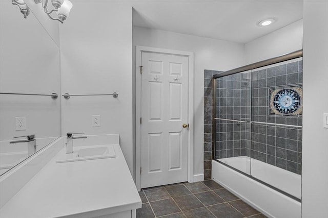 4 Benjamin Pl Unit 4, Brookline, MA 02467 - full bath with combined bath / shower with glass door, double vanity, and tile patterned floors