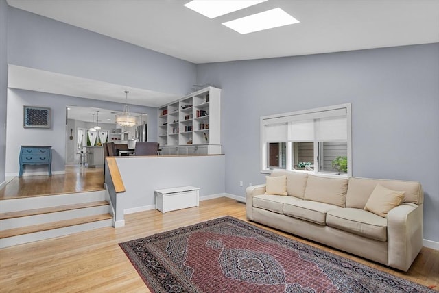 4 Benjamin Pl Unit 4, Brookline, MA 02467 - living room with light wood finished floors and baseboards