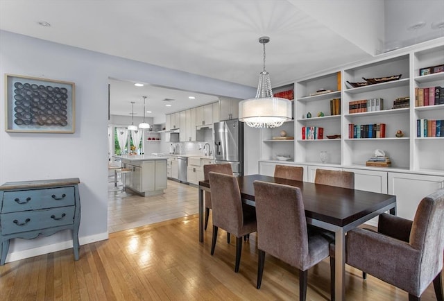 4 Benjamin Pl Unit 4, Brookline, MA 02467 - dining area with light wood-style flooring and baseboards