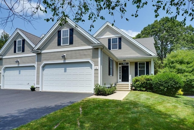 39 Balancing Rock Dr Unit 39, Holliston, MA 01746 - view of front of home featuring driveway, a front yard, and a garage