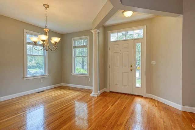 39 Balancing Rock Dr Unit 39, Holliston, MA 01746 - foyer entrance featuring healthy amount of natural light, light wood-style flooring, and decorative columns