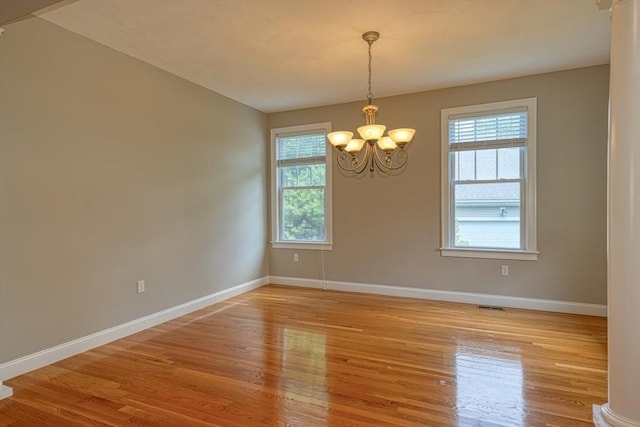 39 Balancing Rock Dr Unit 39, Holliston, MA 01746 - spare room with a chandelier and light wood-style flooring