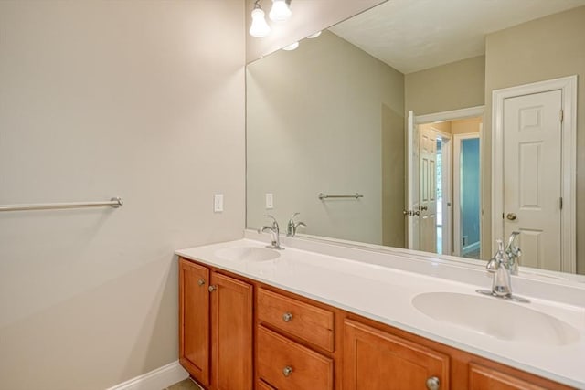 39 Balancing Rock Dr Unit 39, Holliston, MA 01746 - bathroom featuring double vanity and baseboards