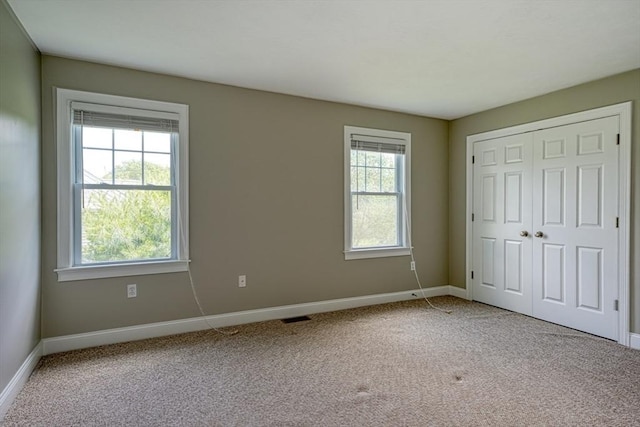 39 Balancing Rock Dr Unit 39, Holliston, MA 01746 - unfurnished bedroom with carpet flooring and a closet