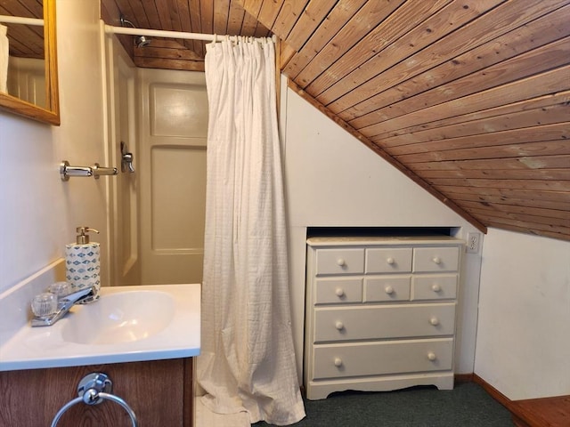 bathroom with vanity, lofted ceiling, and wood ceiling