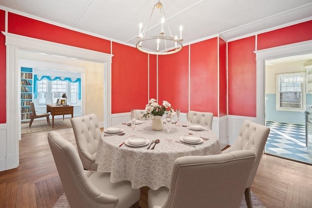 dining room with an inviting chandelier and crown molding