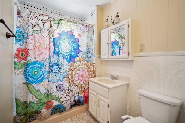 bathroom with vanity, toilet, and curtained shower