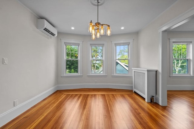 37 Fountain Rd Unit 2, Arlington, MA 02476 - unfurnished dining area featuring an AC wall unit, baseboards, a chandelier, light wood-type flooring, and recessed lighting
