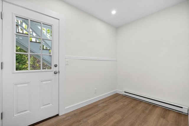 37 Fountain Rd Unit 2, Arlington, MA 02476 - doorway to outside featuring a baseboard radiator, wood finished floors, baseboards, and recessed lighting
