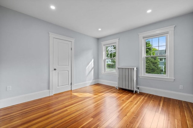 37 Fountain Rd Unit 2, Arlington, MA 02476 - unfurnished room featuring radiator heating unit, light wood-type flooring, baseboards, and recessed lighting