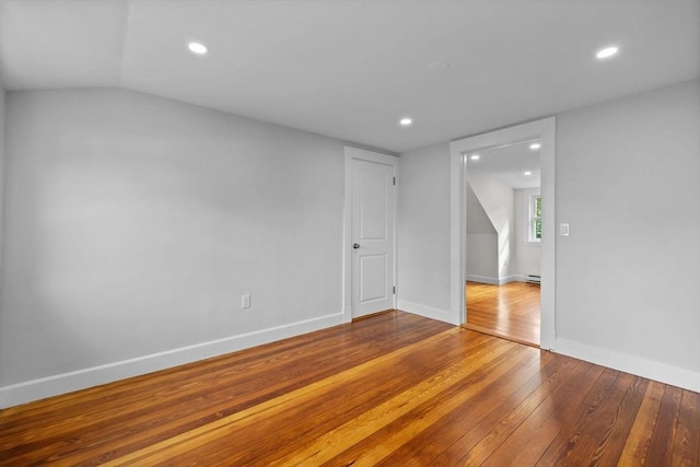 37 Fountain Rd Unit 2, Arlington, MA 02476 - spare room featuring hardwood / wood-style flooring, recessed lighting, baseboards, baseboard heating, and lofted ceiling