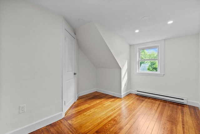 37 Fountain Rd Unit 2, Arlington, MA 02476 - bonus room with a baseboard heating unit, light wood finished floors, baseboards, vaulted ceiling, and recessed lighting