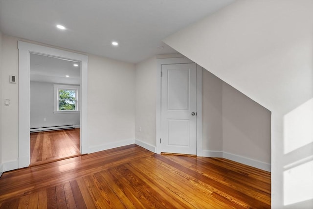 37 Fountain Rd Unit 2, Arlington, MA 02476 - bonus room featuring a baseboard radiator, hardwood / wood-style flooring, baseboards, and recessed lighting