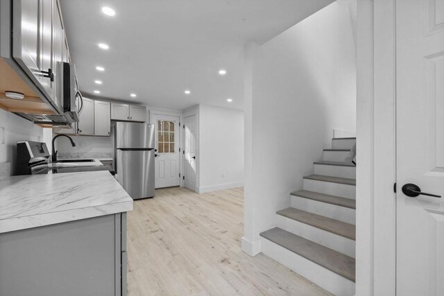 37 Fountain Rd Unit 2, Arlington, MA 02476 - kitchen with appliances with stainless steel finishes, light countertops, light wood-style floors, recessed lighting, and gray cabinets