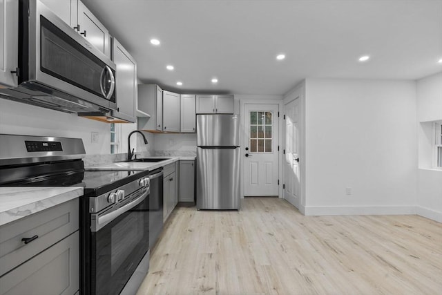37 Fountain Rd Unit 2, Arlington, MA 02476 - kitchen with appliances with stainless steel finishes, gray cabinets, a sink, light wood-type flooring, and recessed lighting