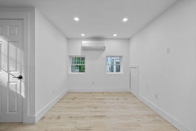 37 Fountain Rd Unit 2, Arlington, MA 02476 - spare room with a wall mounted AC, recessed lighting, wood finished floors, and baseboards