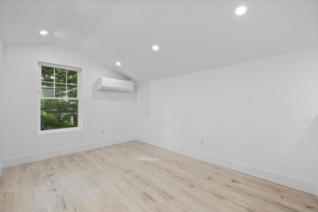 37 Fountain Rd Unit 2, Arlington, MA 02476 - bonus room with a wall unit AC, vaulted ceiling, wood finished floors, recessed lighting, and baseboards