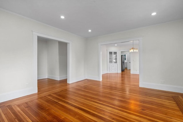 37 Fountain Rd Unit 2, Arlington, MA 02476 - unfurnished room featuring hardwood / wood-style flooring, baseboards, recessed lighting, and ornamental molding