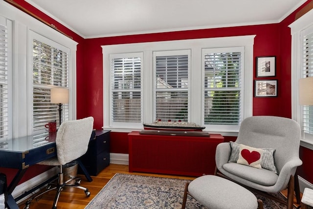home office with baseboards, ornamental molding, and wood finished floors