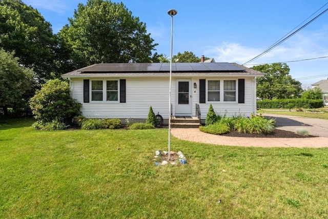 1 Joy St, Franklin, MA 02038 - view of front of home with roof mounted solar panels and a front lawn