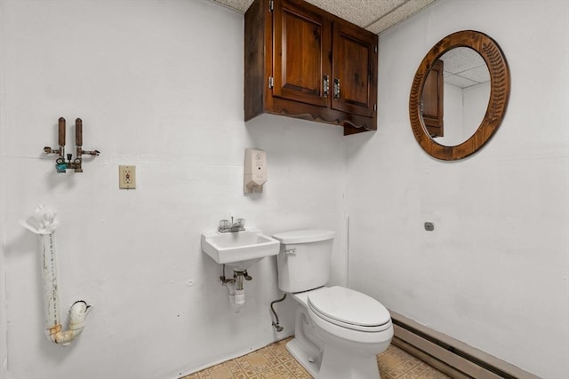 1 Joy St, Franklin, MA 02038 - half bath with a baseboard heating unit and toilet
