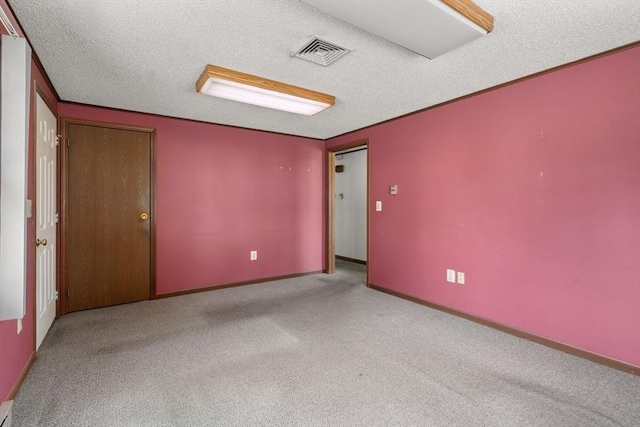 1 Joy St, Franklin, MA 02038 - empty room with carpet floors and a textured ceiling