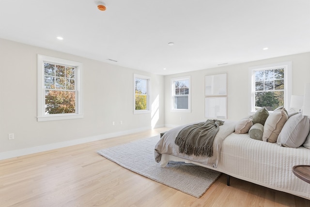 bedroom with light wood-type flooring