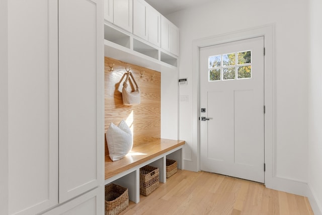 mudroom with light hardwood / wood-style floors