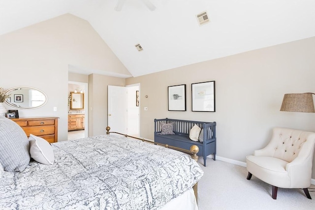 bedroom with visible vents, light carpet, high vaulted ceiling, and connected bathroom