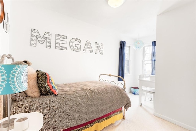 carpeted bedroom with baseboards