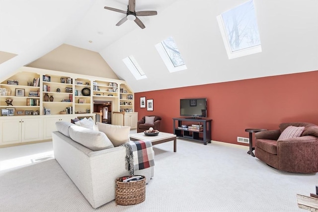 living room featuring baseboards, light carpet, lofted ceiling, and a ceiling fan