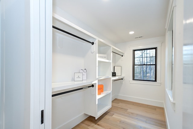 walk in closet featuring light hardwood / wood-style floors