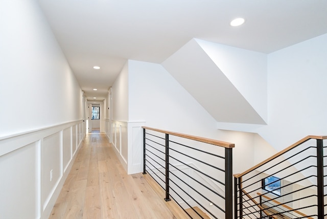 corridor with light hardwood / wood-style flooring