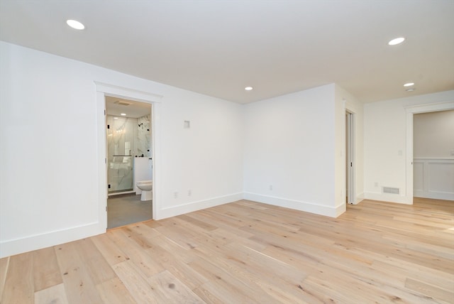 unfurnished room featuring light hardwood / wood-style flooring