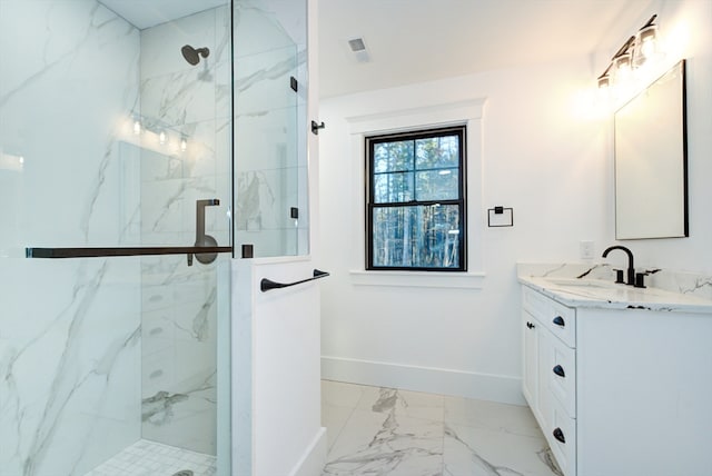 bathroom with vanity and an enclosed shower