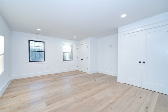 unfurnished room with light hardwood / wood-style floors