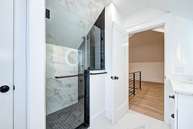 bathroom featuring hardwood / wood-style floors and a shower with shower door