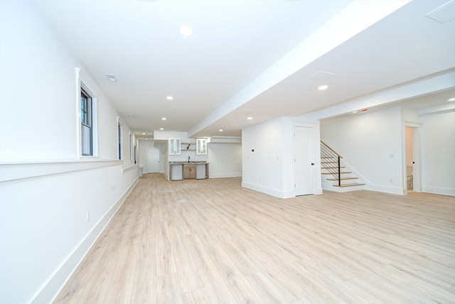 unfurnished living room with light wood-type flooring