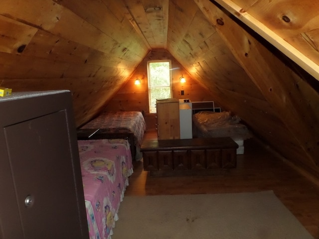 bedroom featuring lofted ceiling, hardwood / wood-style floors, and wooden ceiling