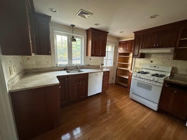 283 Woodland Rd, Newton, MA 02466 - kitchen with visible vents, white appliances, under cabinet range hood, a sink, and dark wood finished floors