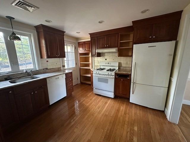 283 Woodland Rd, Newton, MA 02466 - kitchen featuring open shelves, a sink, white appliances, wood-type flooring, and under cabinet range hood