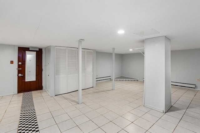 18 Newhall St, Malden, MA 02148 - finished below grade area with a baseboard heating unit, a baseboard radiator, recessed lighting, and light tile patterned floors