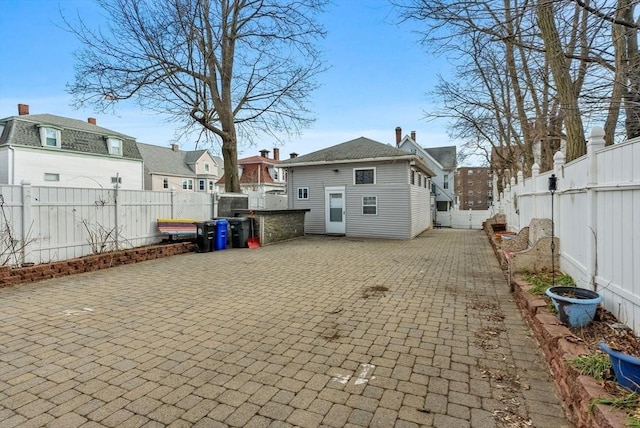 18 Newhall St, Malden, MA 02148 - back of property with a residential view, a patio, and a fenced backyard